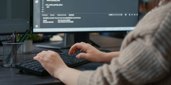 a person typing on a keyboard